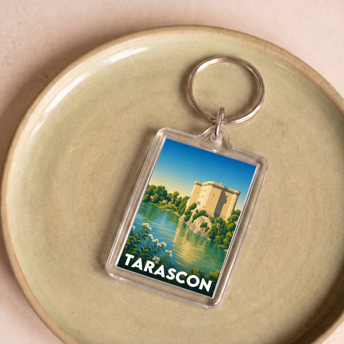 Porte-clés souvenir de la ville de Tarascon avec une illustration stylisée.