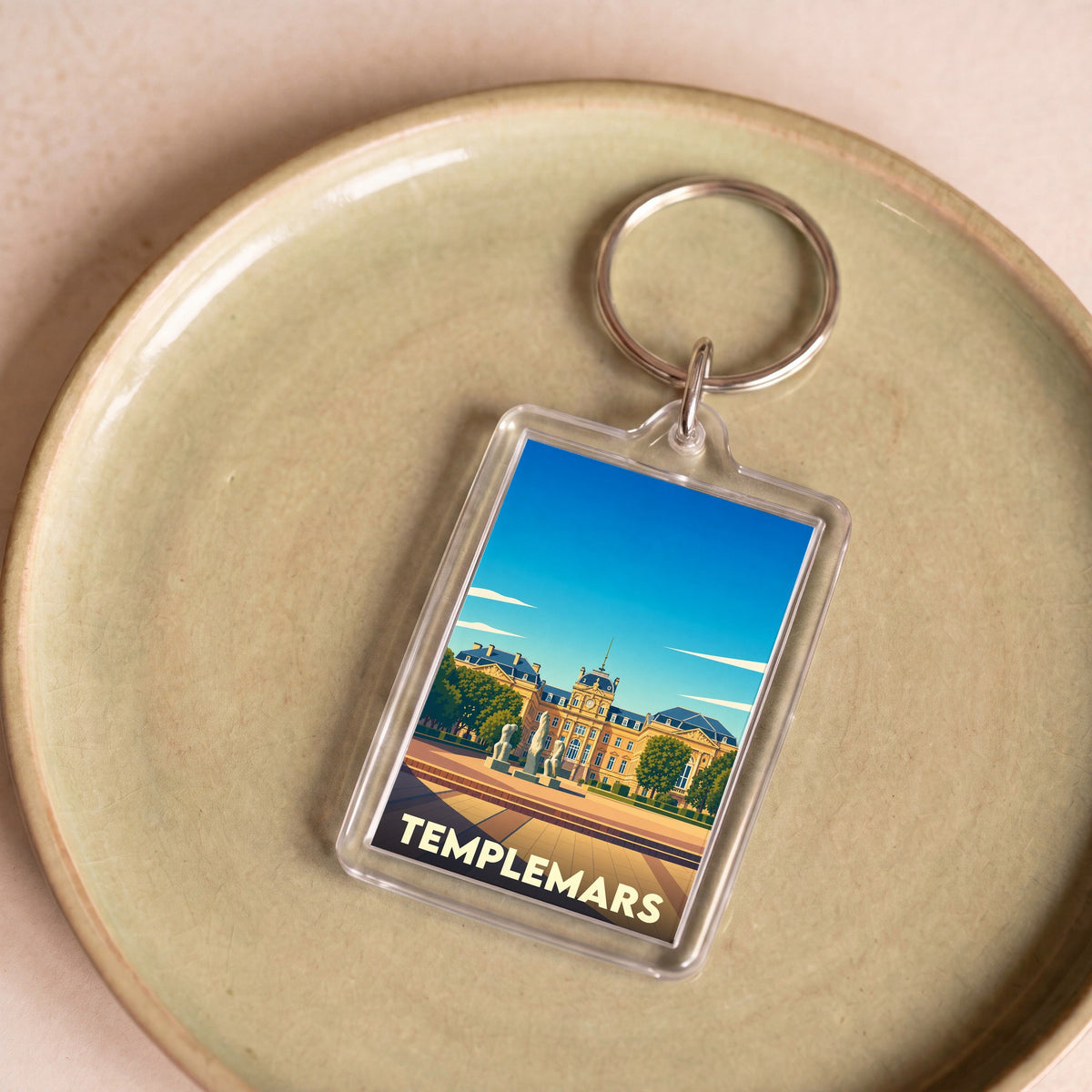 Porte-clés souvenir de la ville de Templemars avec une illustration stylisée.
