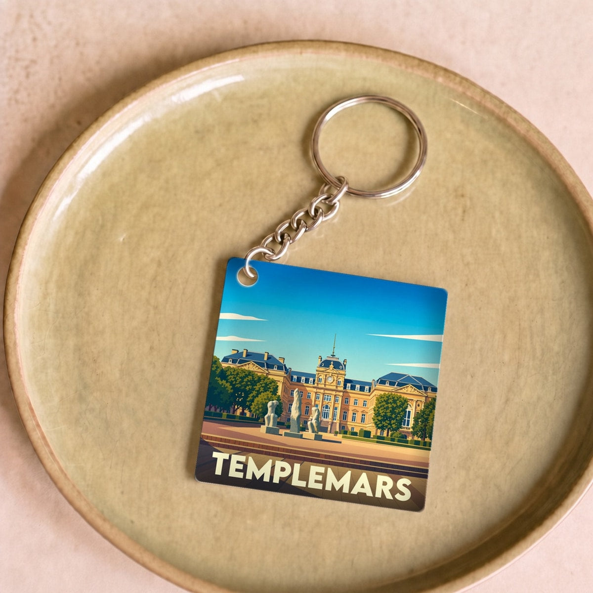 Porte-clés souvenir de la ville de Templemars avec une illustration stylisée.