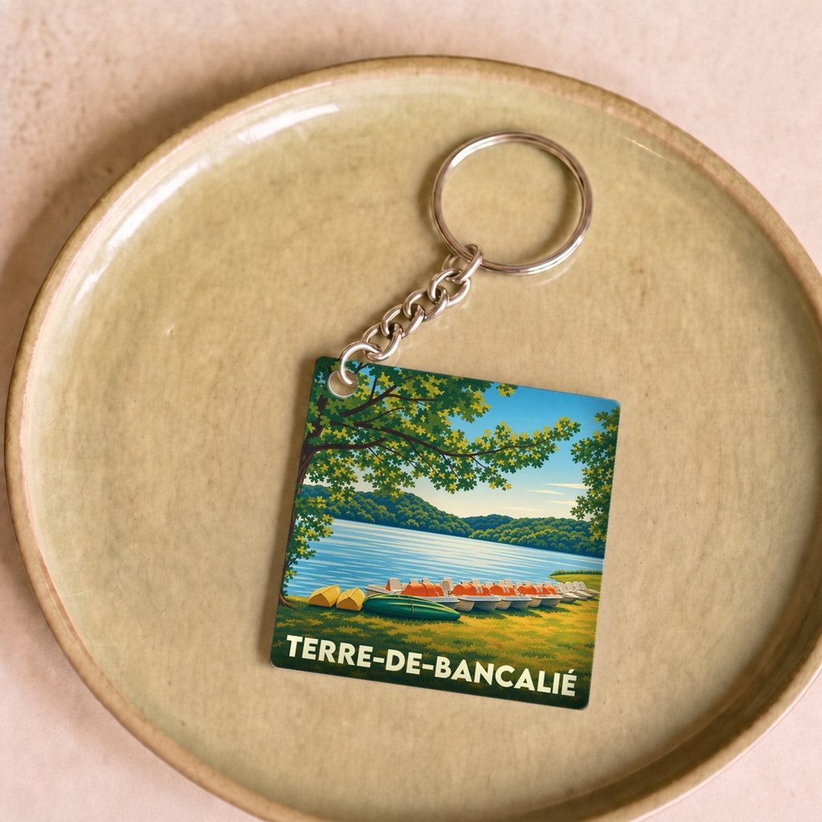 Porte-clés souvenir de la ville de Terre-de-Bancalié avec une illustration stylisée.