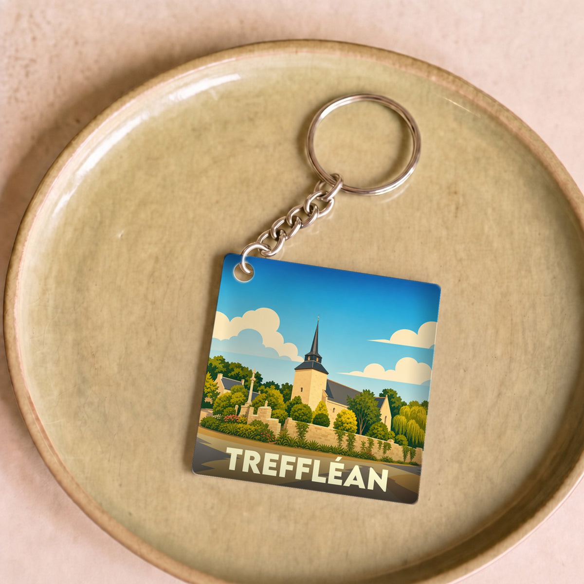 Porte-clés souvenir de la ville de Treffléan avec une illustration stylisée.