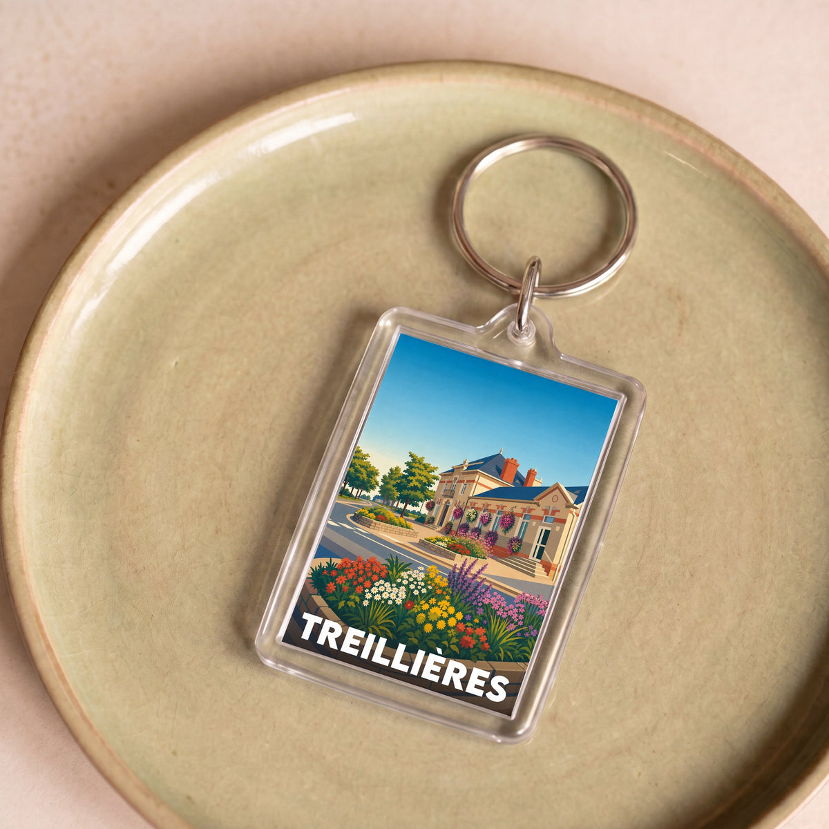 Porte-clés souvenir de la ville de Treillières avec une illustration stylisée.