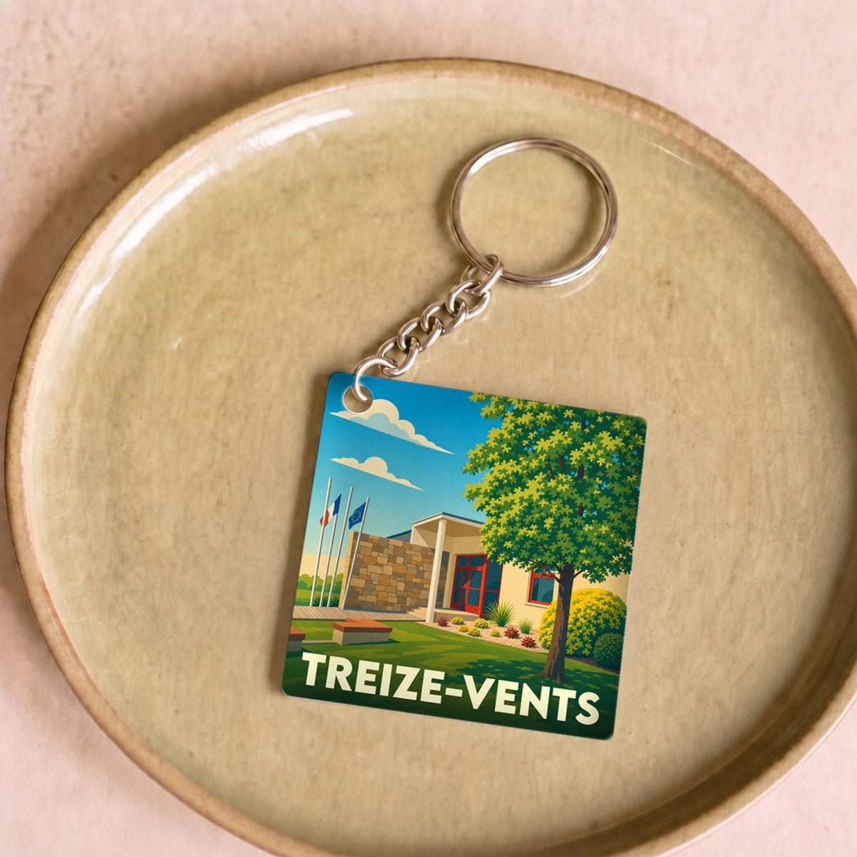 Porte-clés souvenir de la ville de Treize-Vents avec une illustration stylisée.