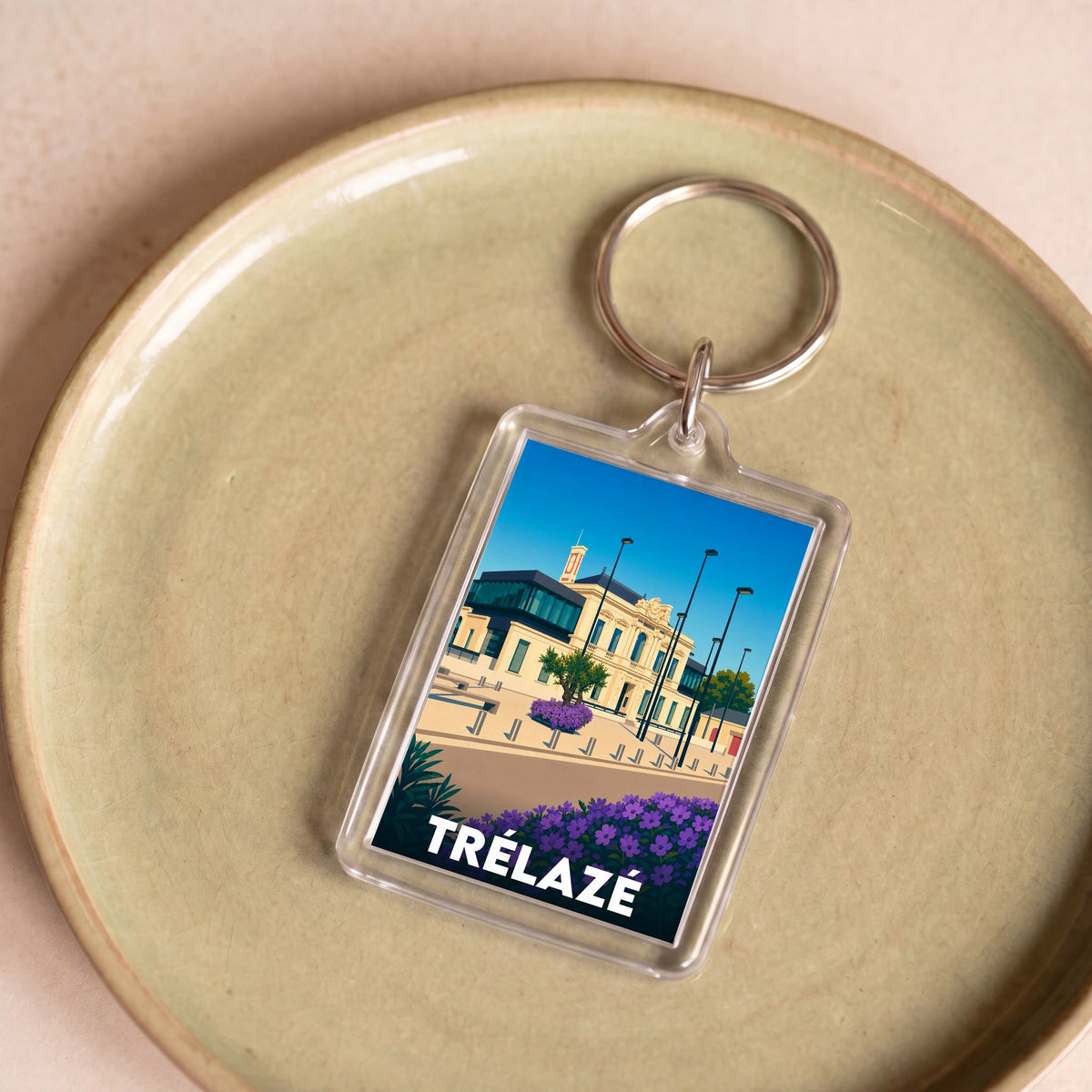 Porte-clés souvenir de la ville de Trélazé avec une illustration stylisée.