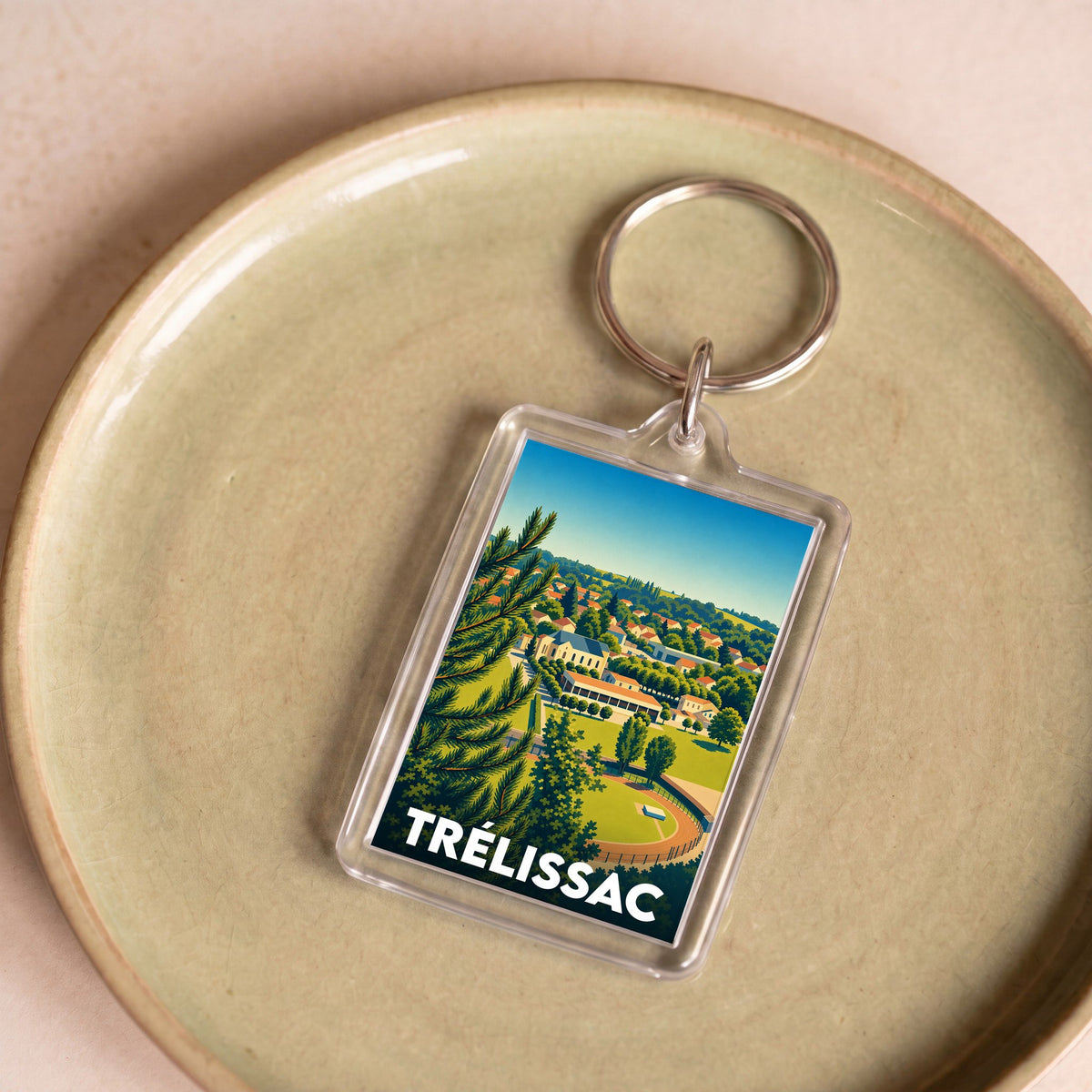 Porte-clés souvenir de la ville de Trélissac avec une illustration stylisée.