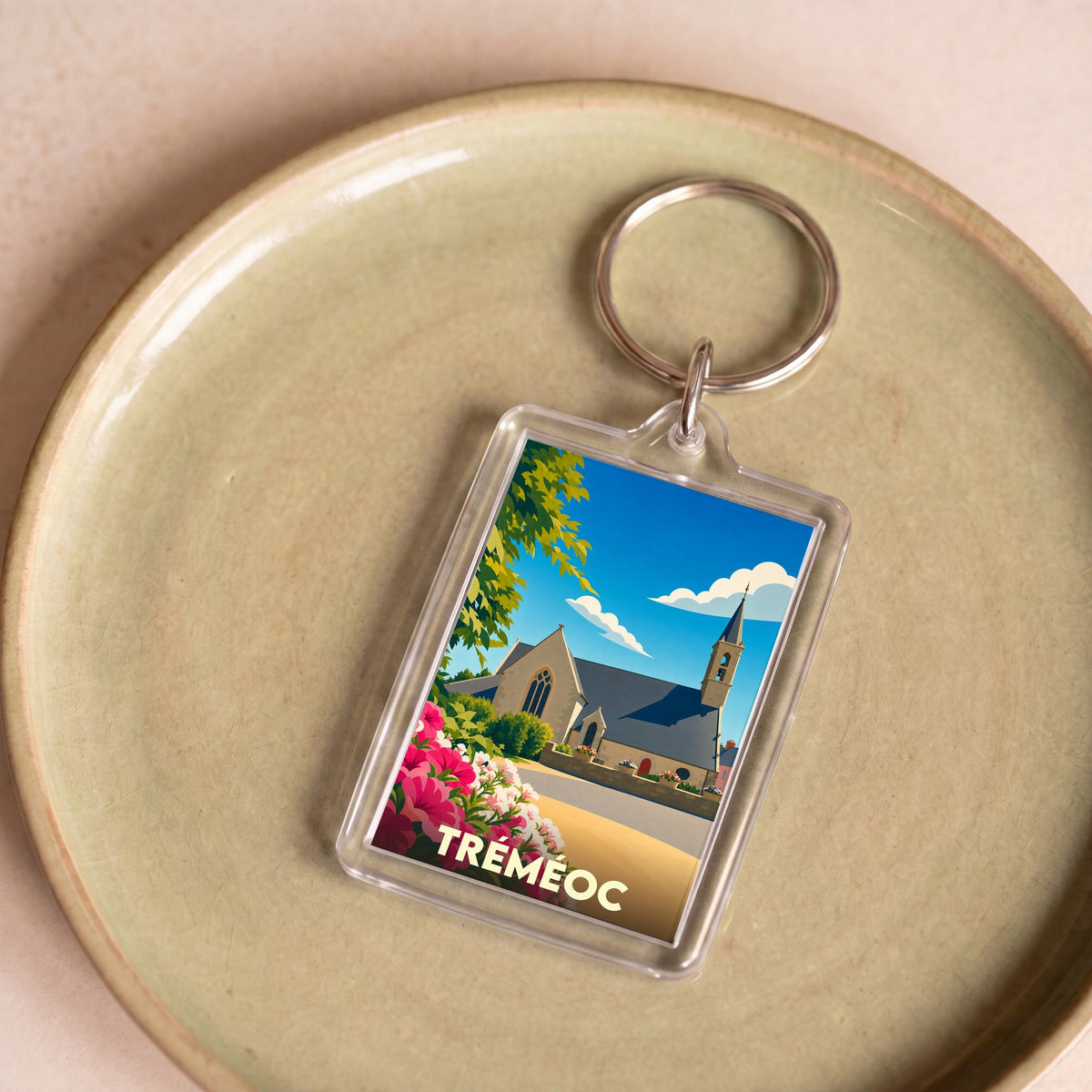 Porte-clés souvenir de la ville de Tréméoc avec une illustration stylisée.