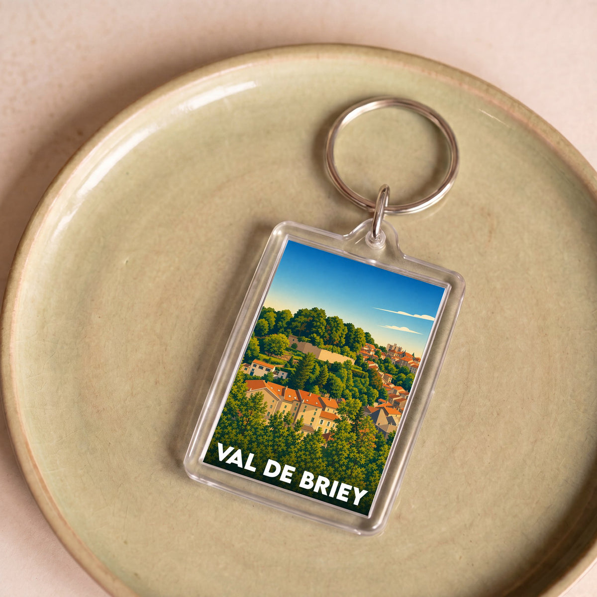 Porte-clés souvenir de la ville de Val de Briey avec une illustration stylisée.
