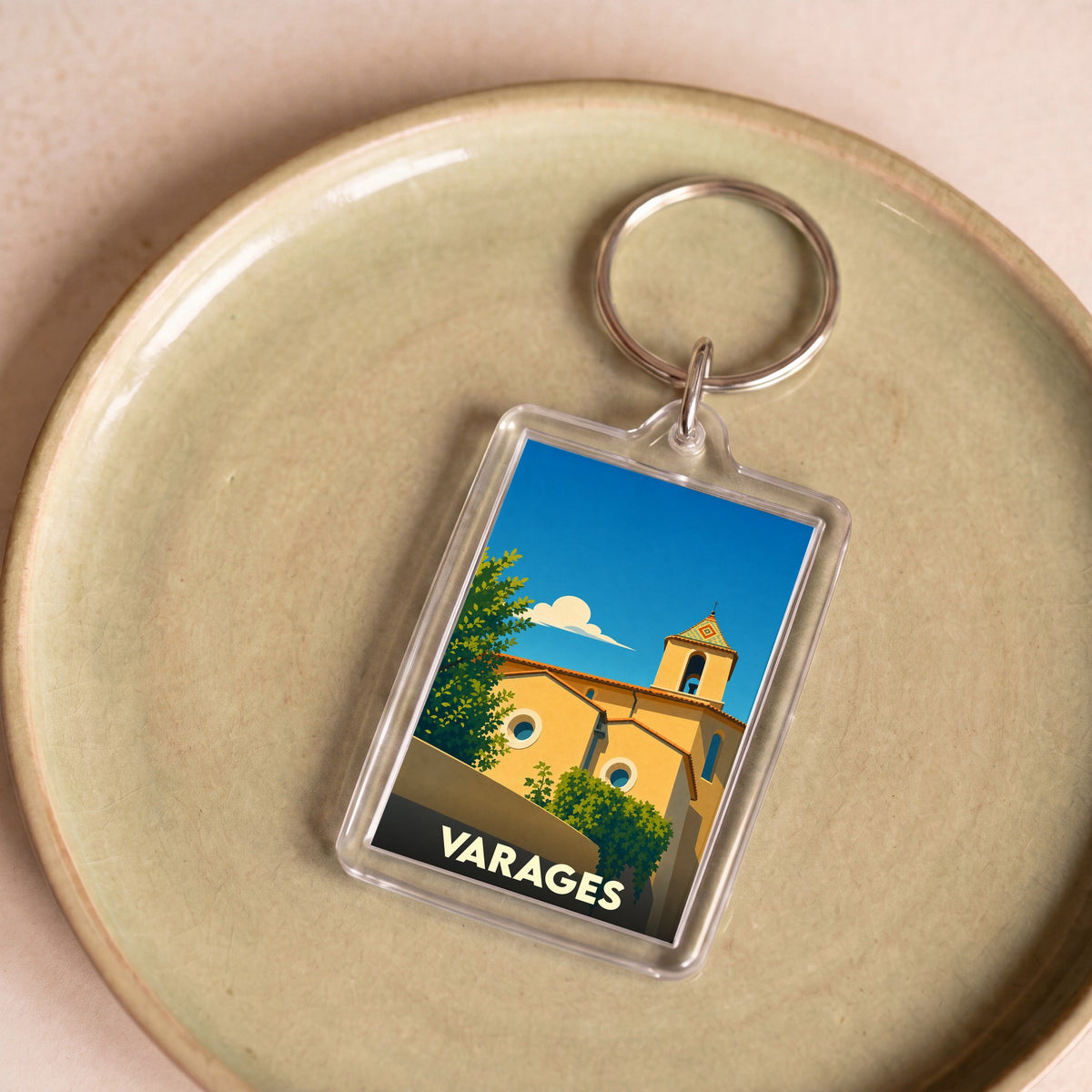 Porte-clés souvenir de la ville de Varages avec une illustration stylisée.