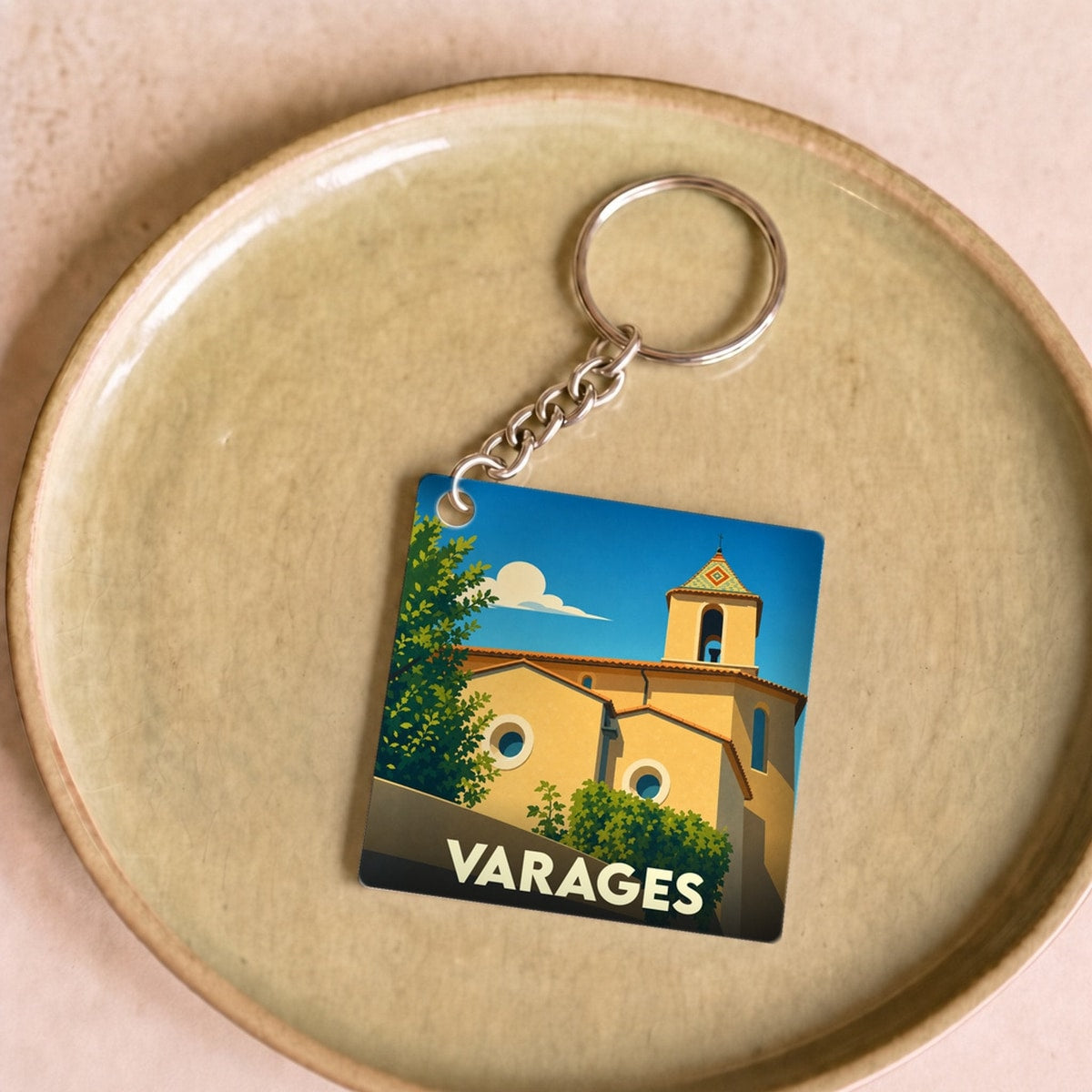 Porte-clés souvenir de la ville de Varages avec une illustration stylisée.