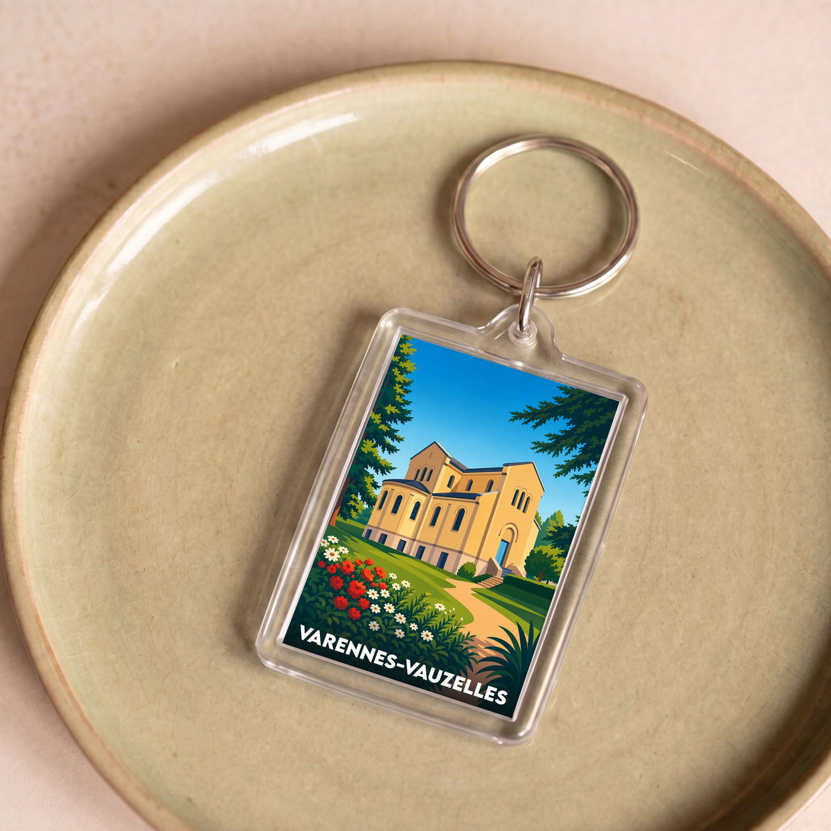 Porte-clés souvenir de la ville de Varennes-Vauzelles avec une illustration stylisée.