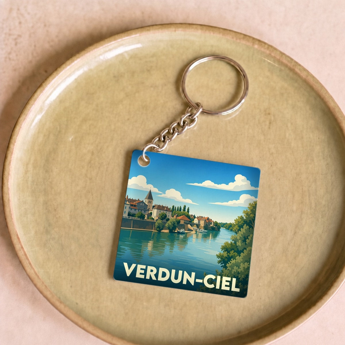 Porte-clés souvenir de la ville de Verdun-Ciel avec une illustration stylisée.