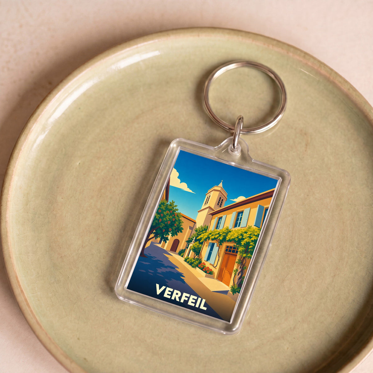 Porte-clés souvenir de la ville de Verfeil avec une illustration stylisée.