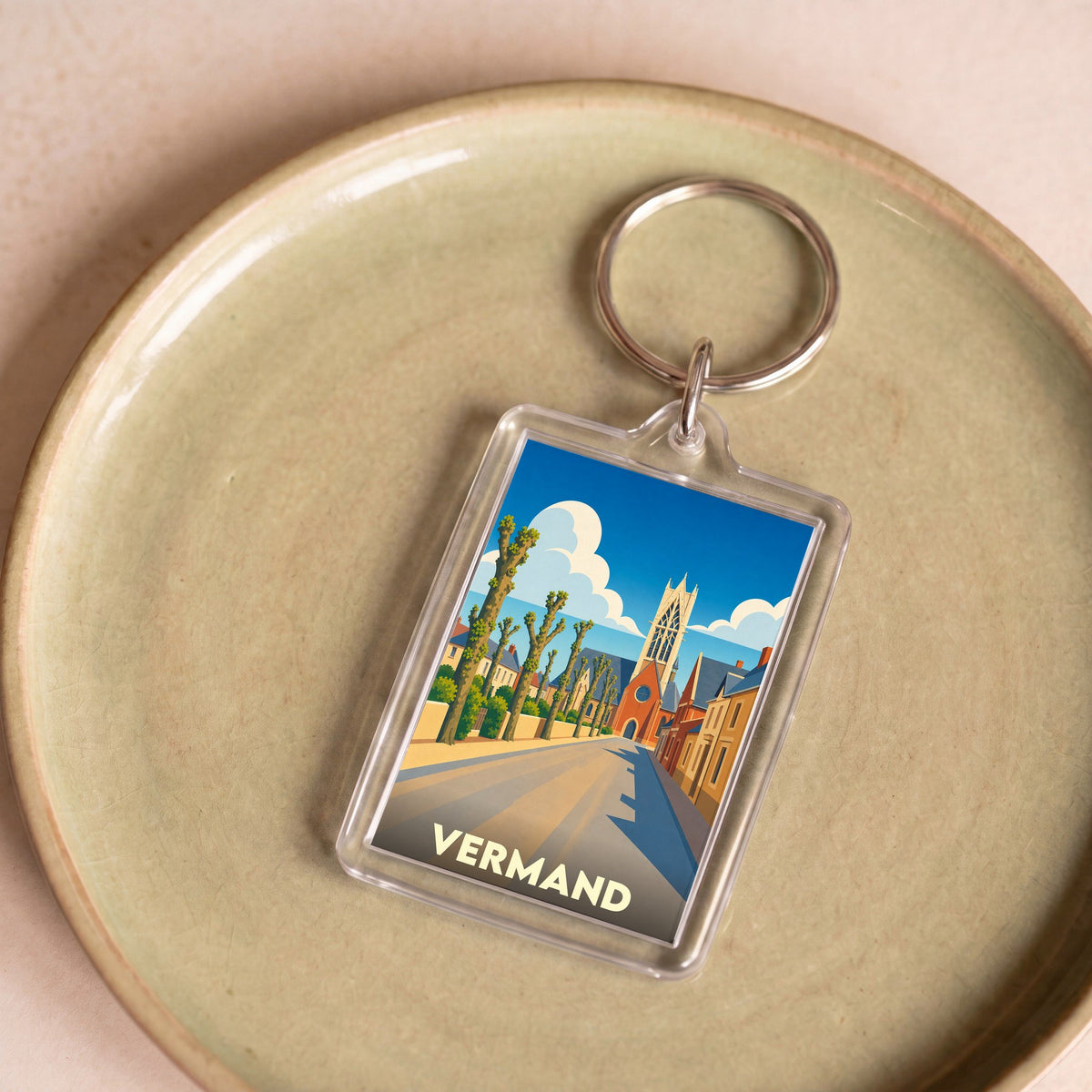 Porte-clés souvenir de la ville de Vermand avec une illustration stylisée.
