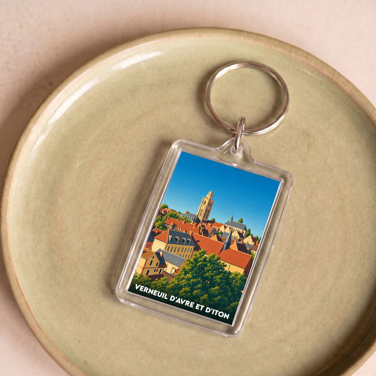 Porte-clés souvenir de la ville de Verneuil d'Avre et d'Iton avec une illustration stylisée.