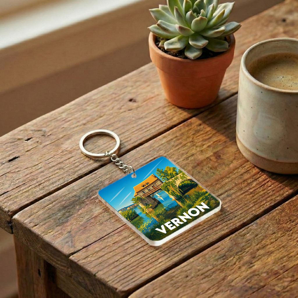 Porte-clés souvenir de la ville de Vernon avec une illustration stylisée.