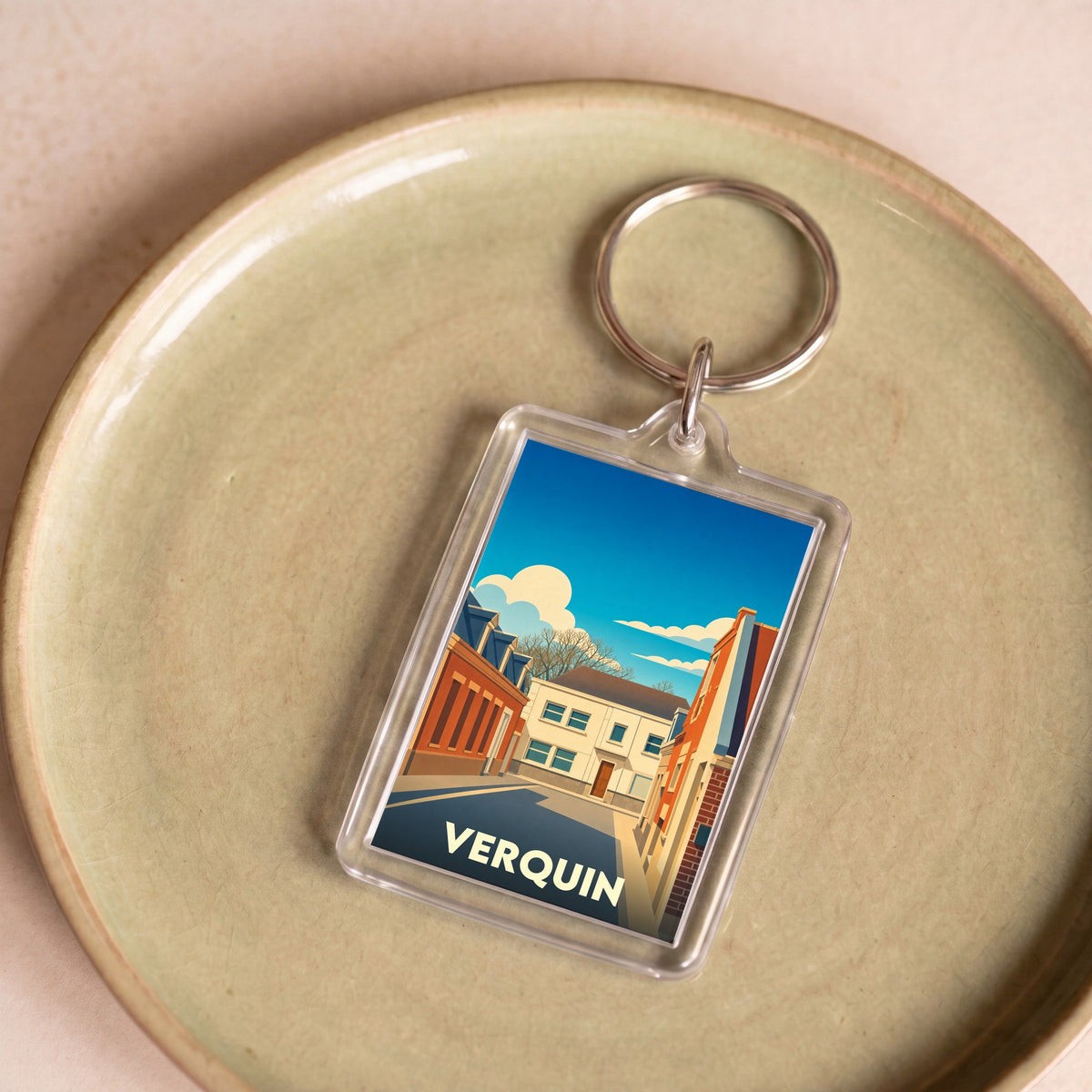 Porte-clés souvenir de la ville de Verquin avec une illustration stylisée.