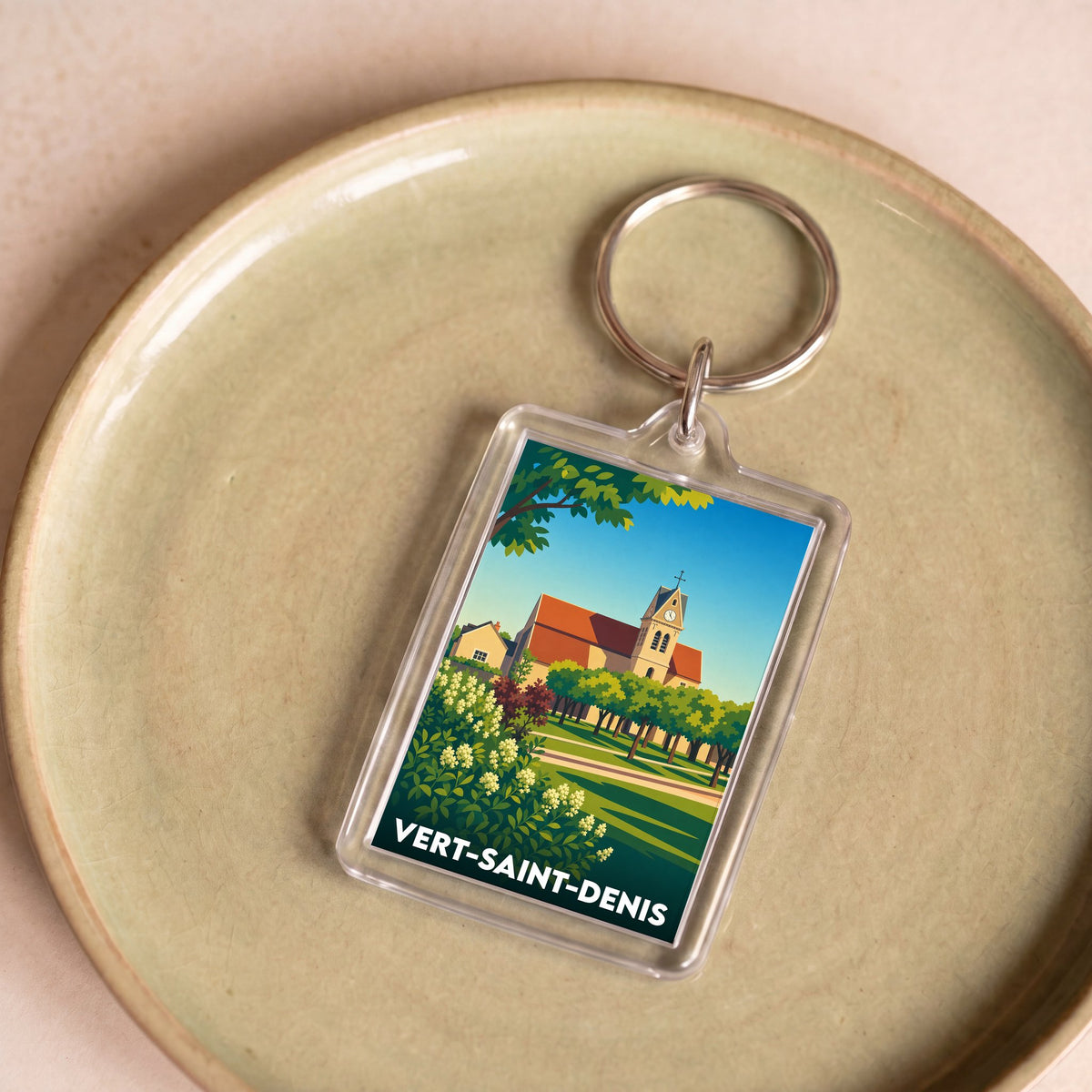 Porte-clés souvenir de la ville de Vert-Saint-Denis avec une illustration stylisée.
