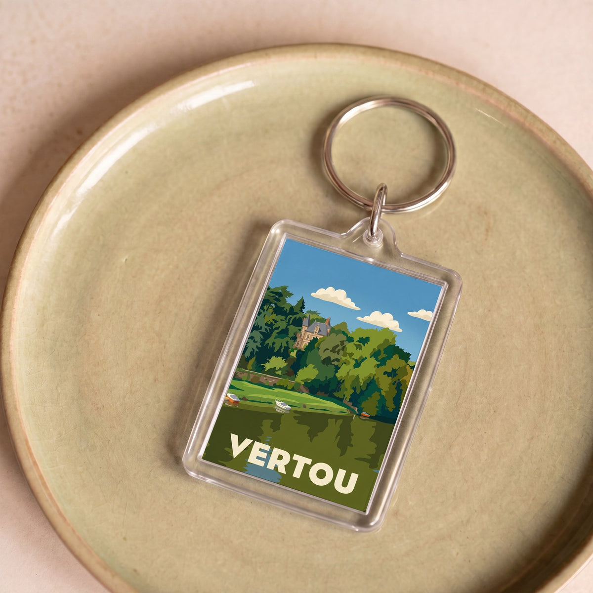 Porte-clés souvenir de la ville de Vertou avec une illustration stylisée.