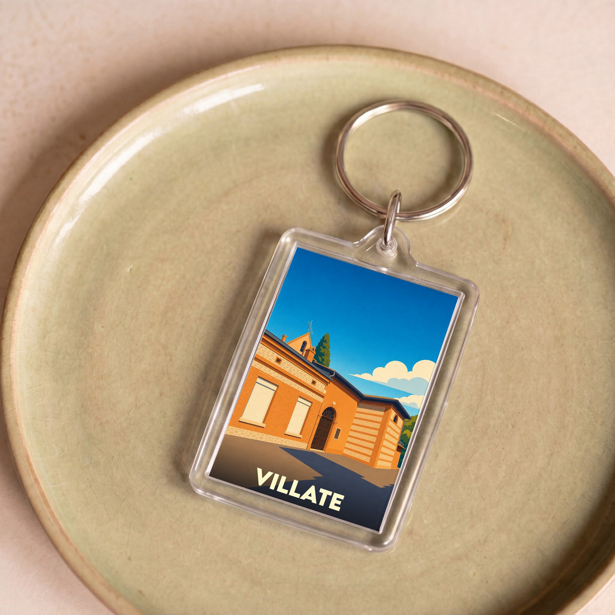 Porte-clés souvenir de la ville de Villate avec une illustration stylisée.