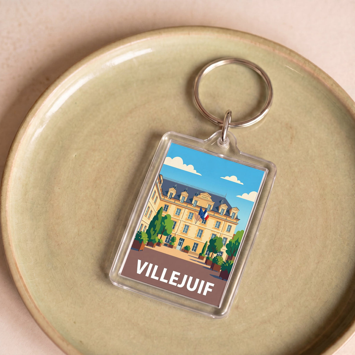 Porte-clés souvenir de la ville de Villejuif avec une illustration stylisée.