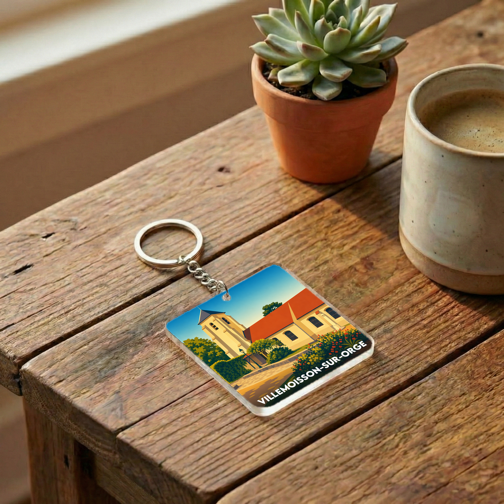 Porte-clés souvenir de la ville de Villemoisson-sur-Orge avec une illustration stylisée.