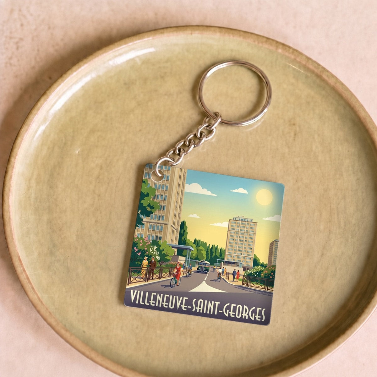 Porte-clés souvenir de la ville de Villeneuve-Saint-Georges avec une illustration stylisée.