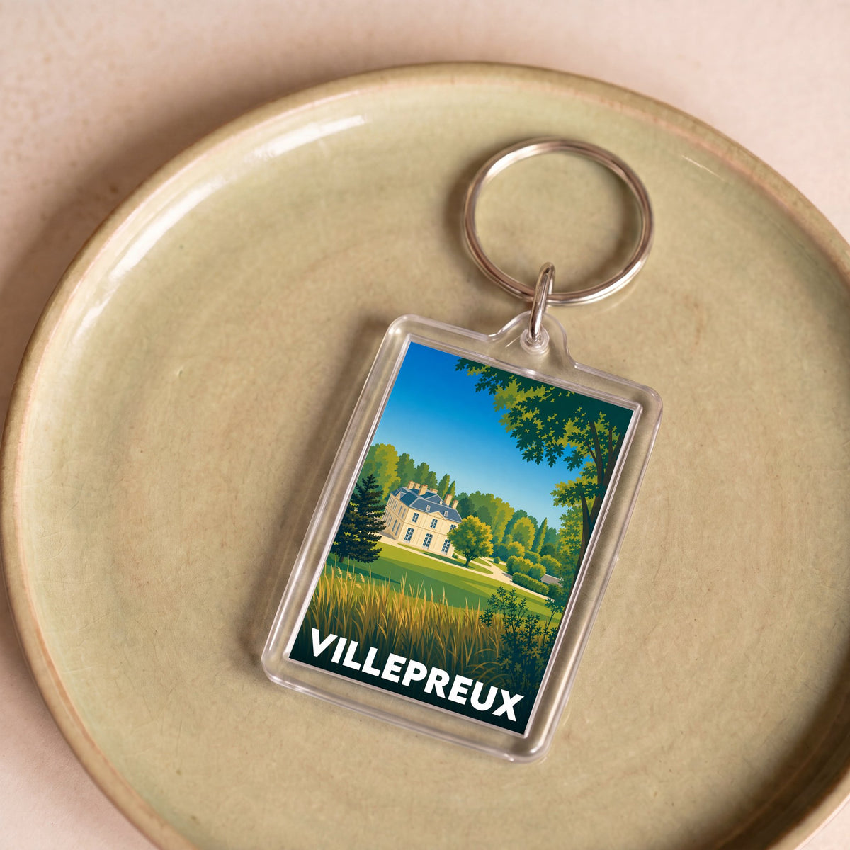 Porte-clés souvenir de la ville de Villepreux avec une illustration stylisée.