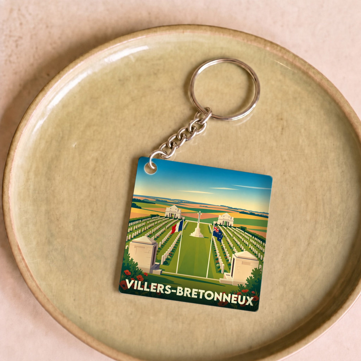 Porte-clés souvenir de la ville de Villers-Bretonneux avec une illustration stylisée de son mémorial.