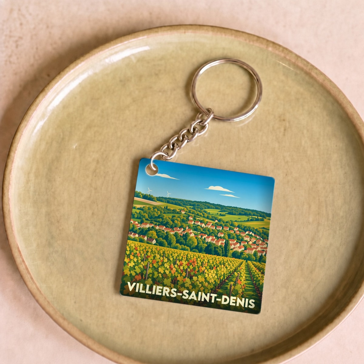 Porte-clés souvenir de la ville de Villiers-Saint-Denis avec une illustration stylisée de ses vignes.