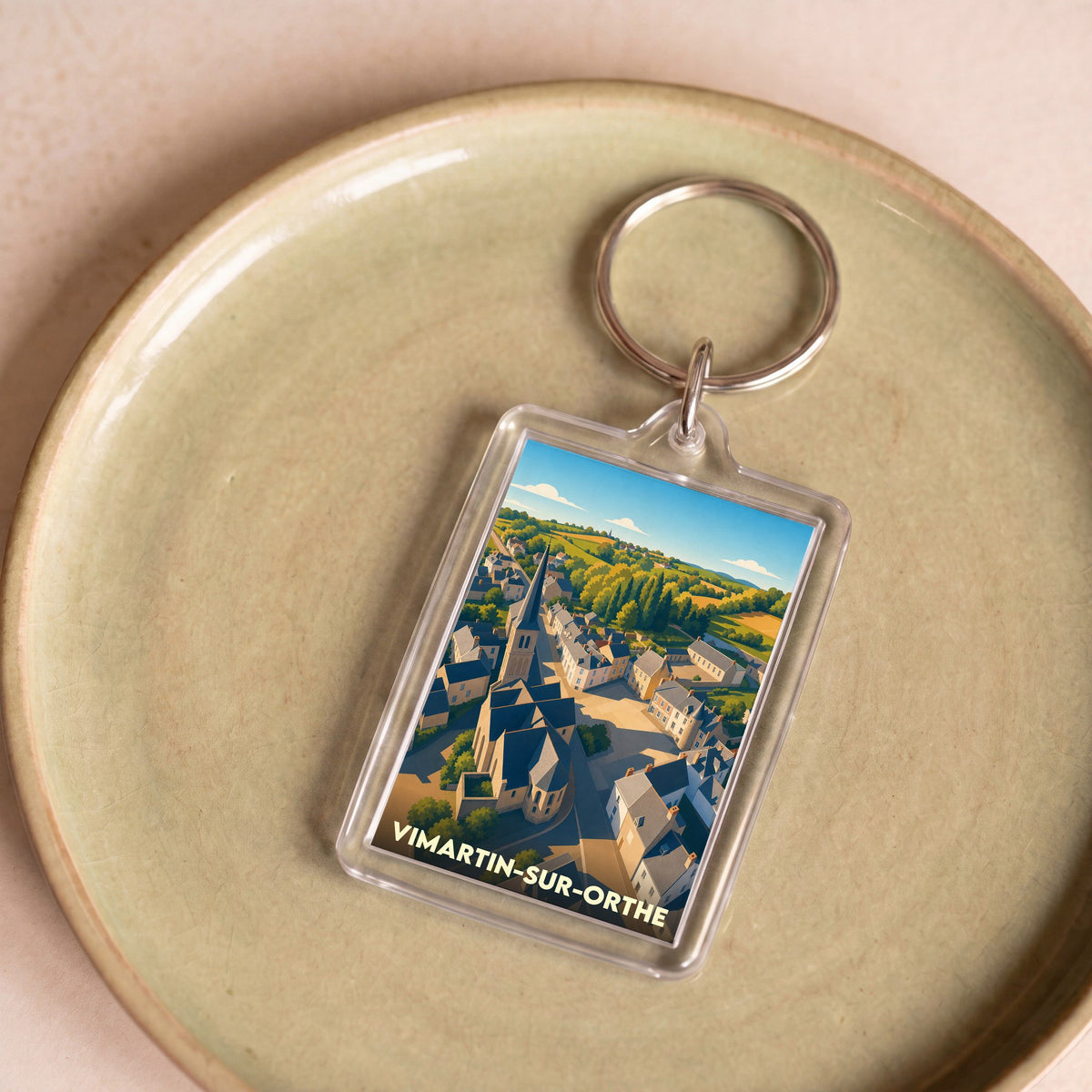Porte-clés souvenir de la ville de Vimartin-sur-Orthe avec une illustration stylisée.