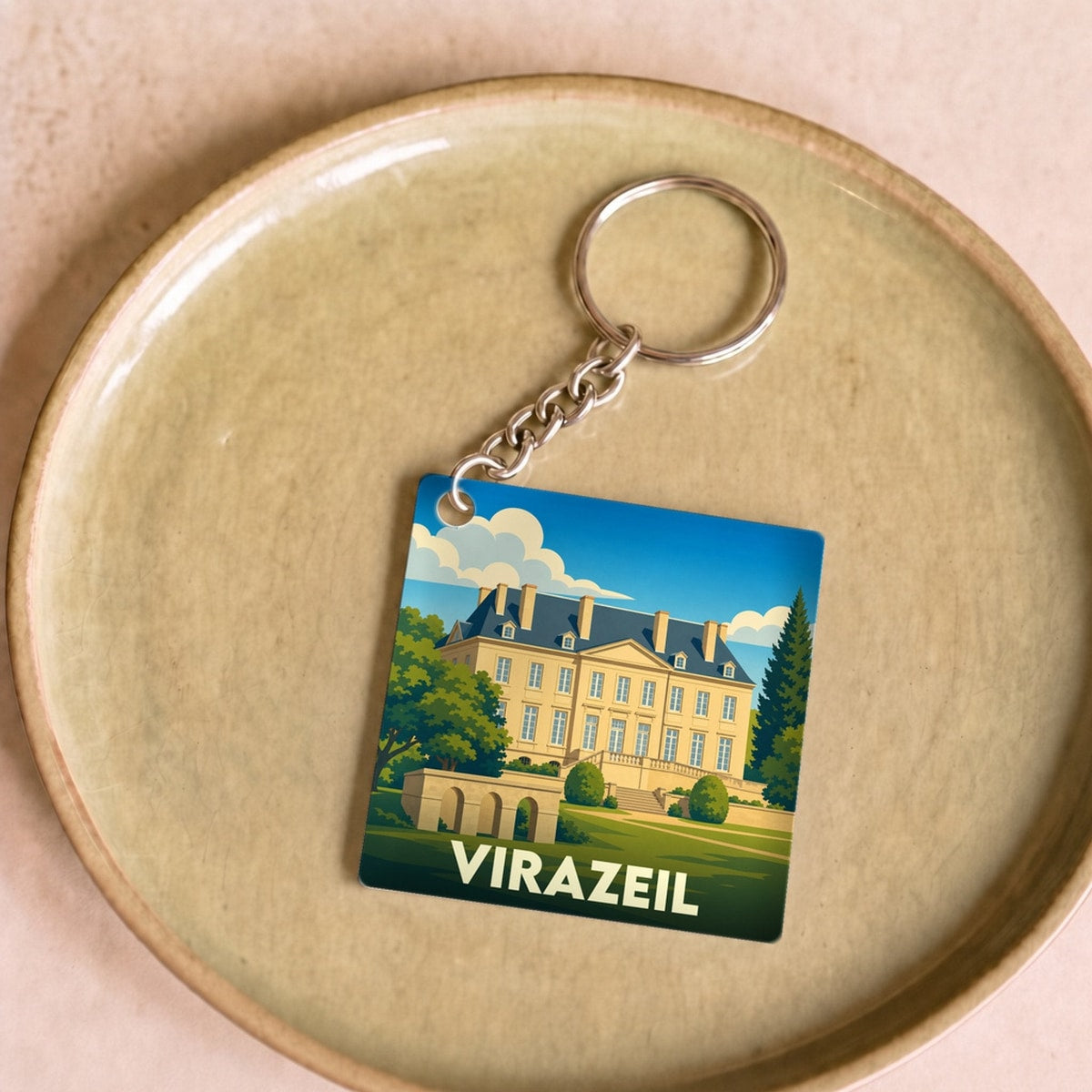 Porte-clés souvenir de la ville de Virazeil avec une illustration stylisée.