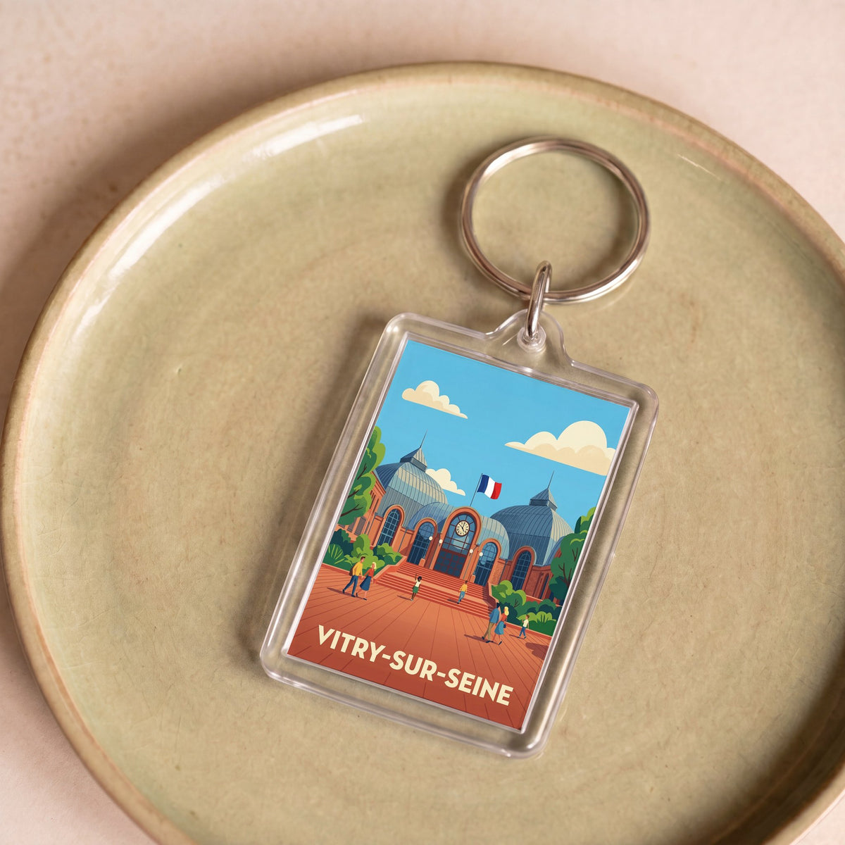 Porte-clés souvenir de la ville de Vitry-sur-Seine avec une illustration stylisée.