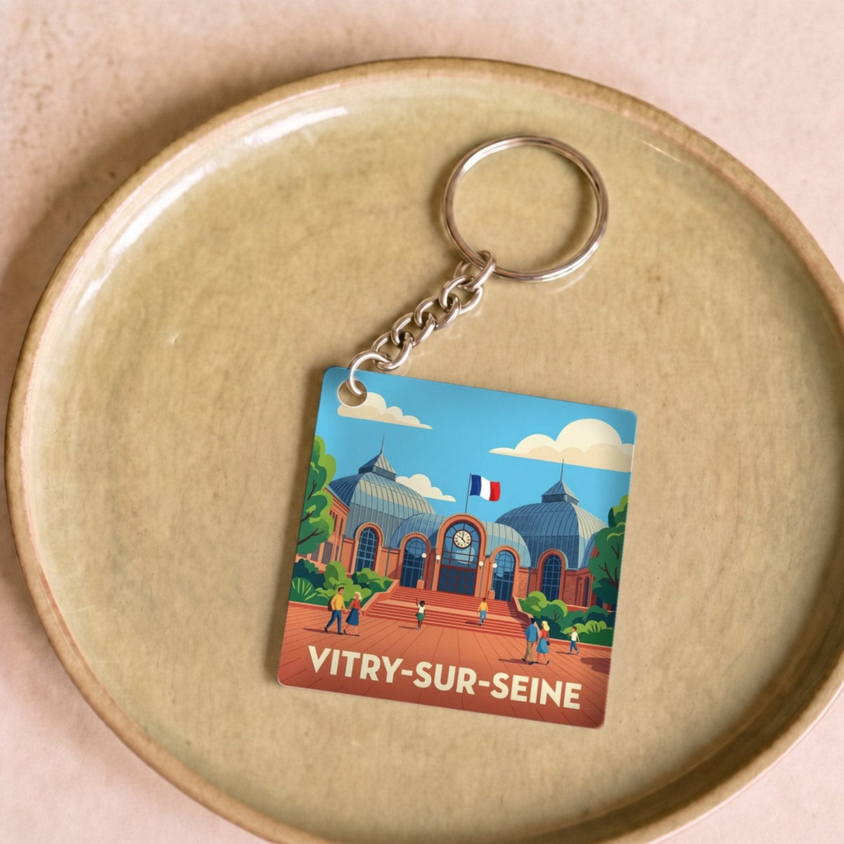 Porte-clés souvenir de la ville de Vitry-sur-Seine avec une illustration stylisée.