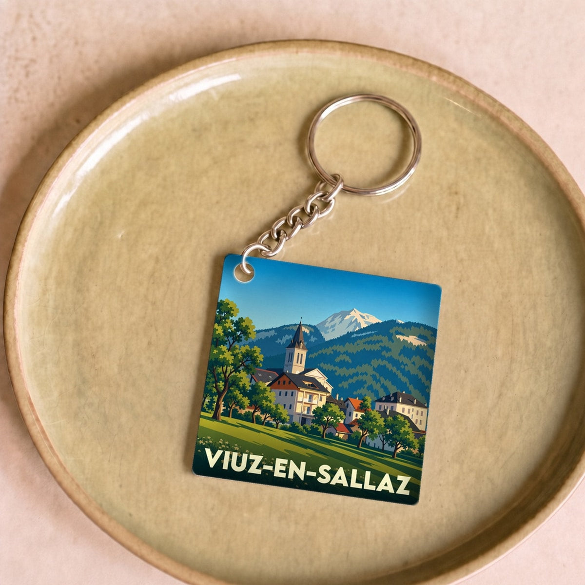 Porte-clés souvenir de la ville de Viuz-en-Sallaz avec une illustration stylisée.