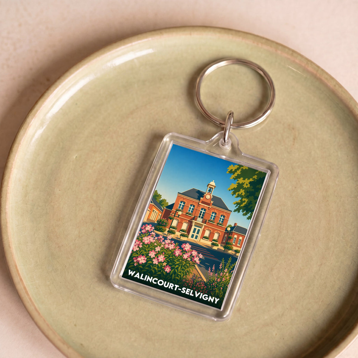 Porte-clés souvenir de la ville de Walincourt-Selvigny avec une illustration stylisée.