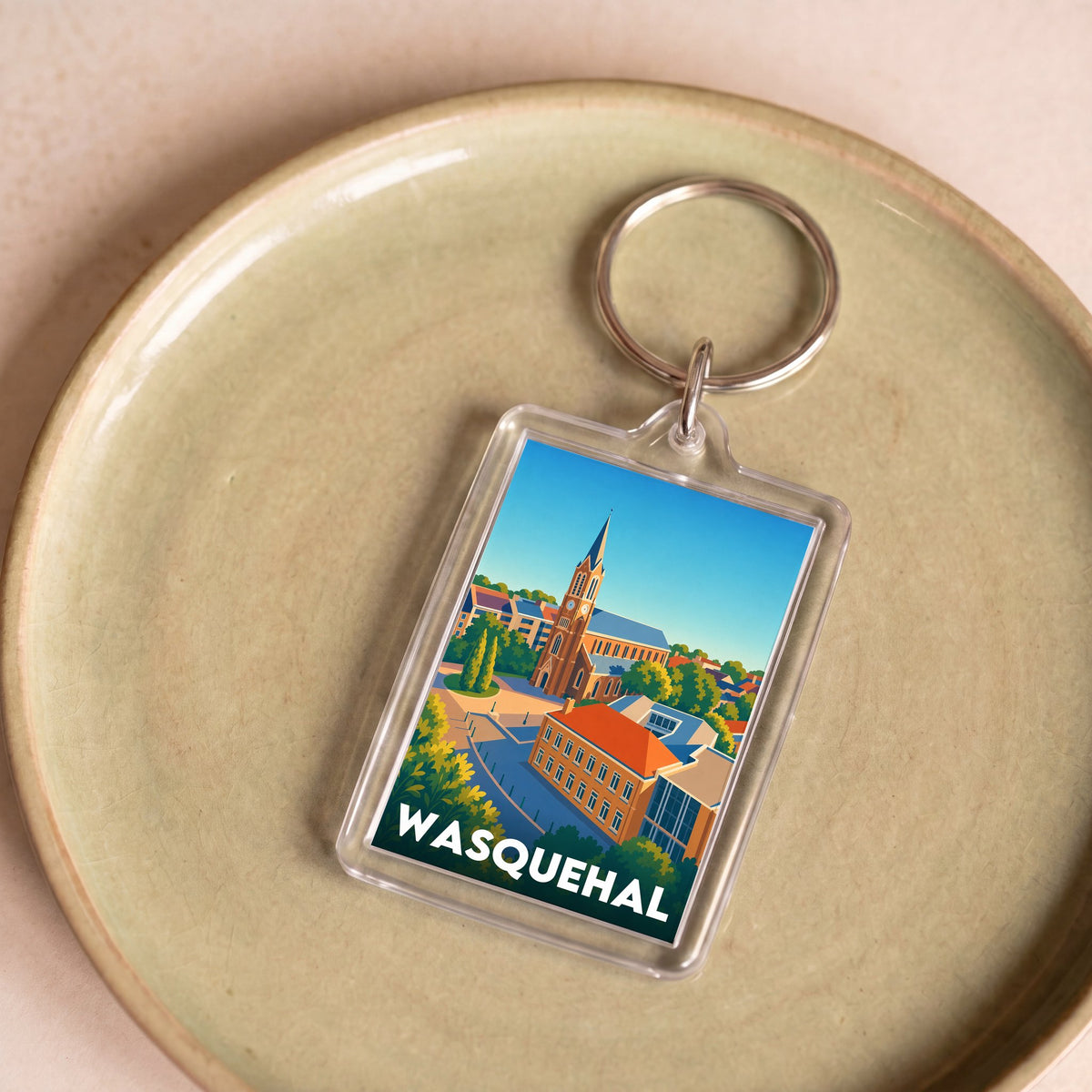 Porte-clés souvenir de la ville de Wasquehal avec une illustration stylisée.