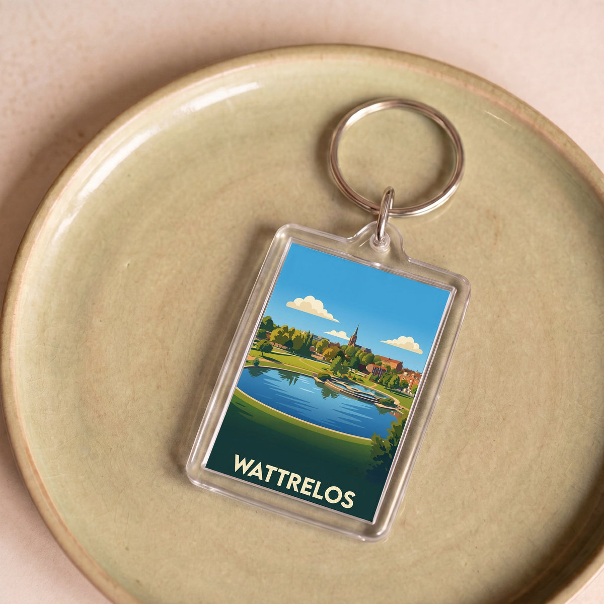 Porte-clés souvenir de la ville de Wattrelos avec une illustration stylisée.