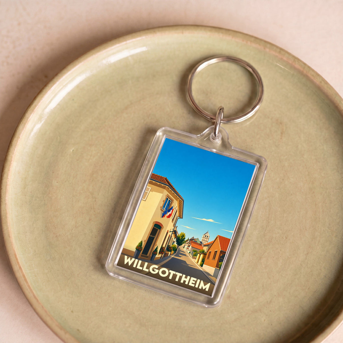 Porte-clés souvenir de la ville de Willgottheim avec une illustration stylisée.
