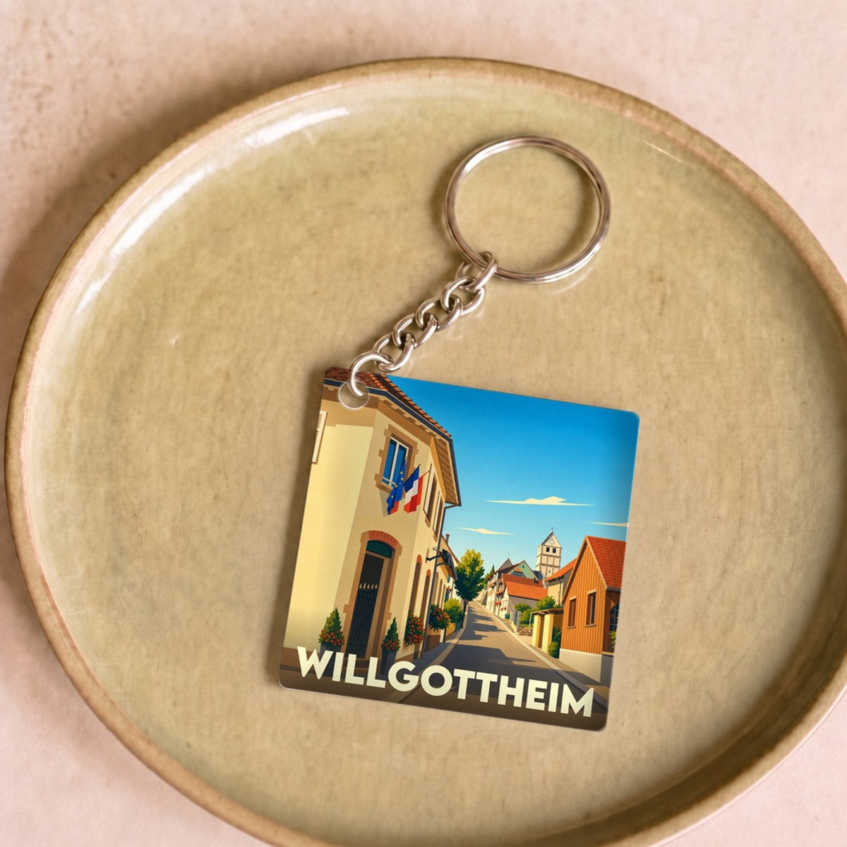 Porte-clés souvenir de la ville de Willgottheim avec une illustration stylisée.