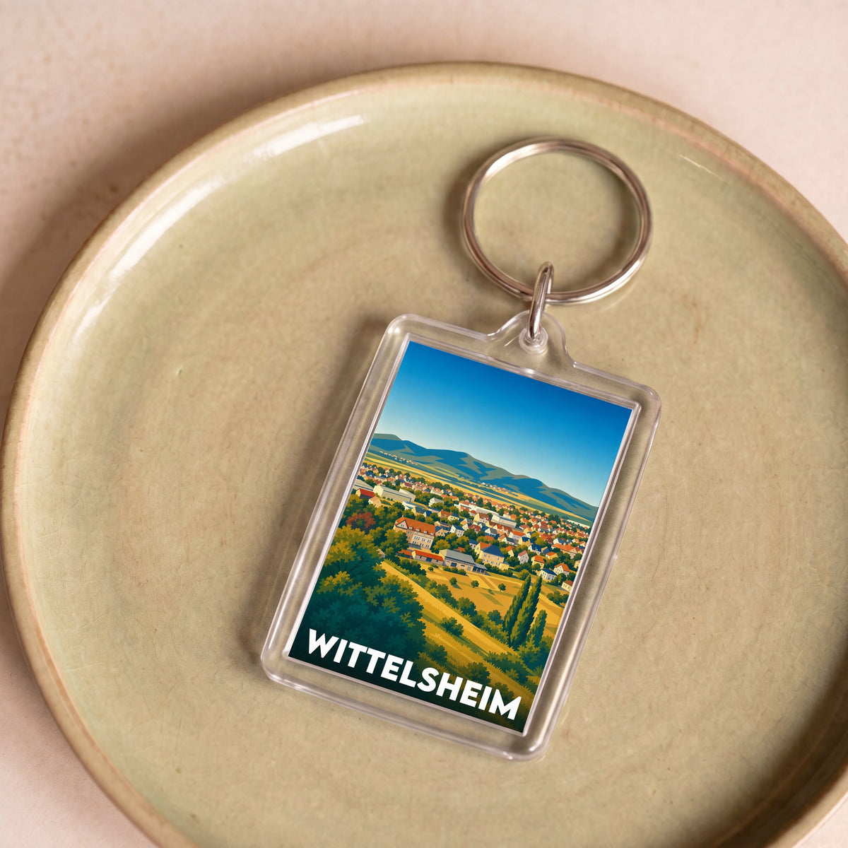 Porte-clés souvenir de la ville de Wittelsheim avec une illustration stylisée.