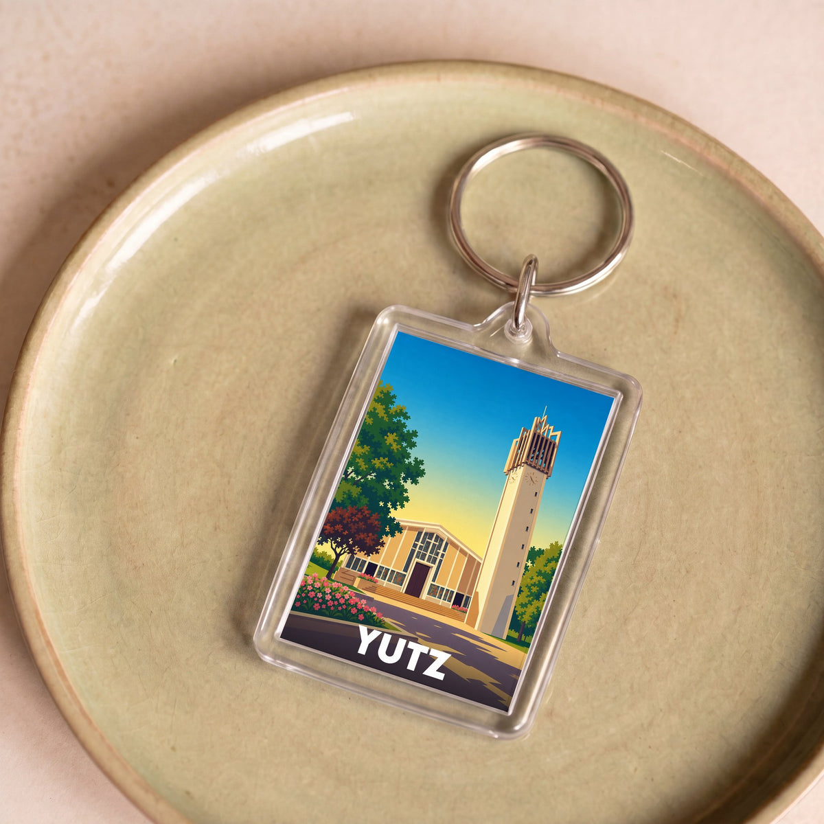 Porte-clés souvenir de la ville de Yutz avec une illustration stylisée de son architecture.