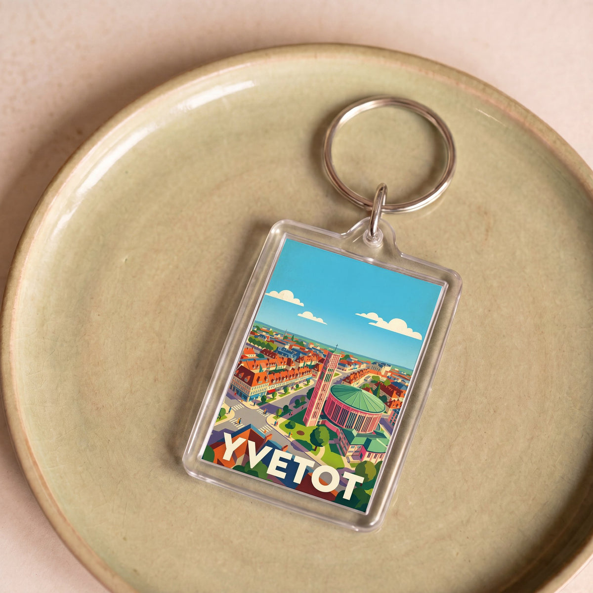 Porte-clés souvenir de la ville d'Yvetot avec une illustration stylisée.