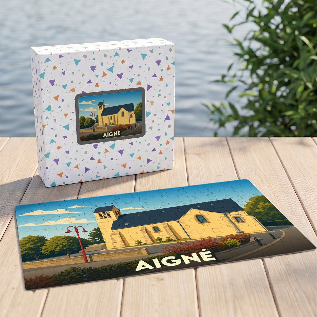Puzzle souvenir de la ville de Aigné représentant son église avec une illustration stylisée.