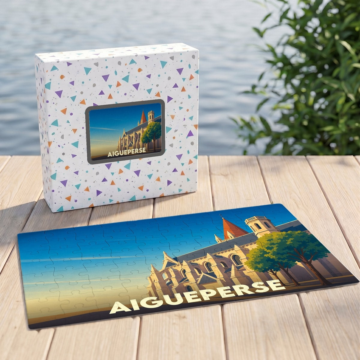 Puzzle souvenir de la ville d'Aigueperse avec une illustration stylisée d'un bâtiment historique au coucher du soleil.