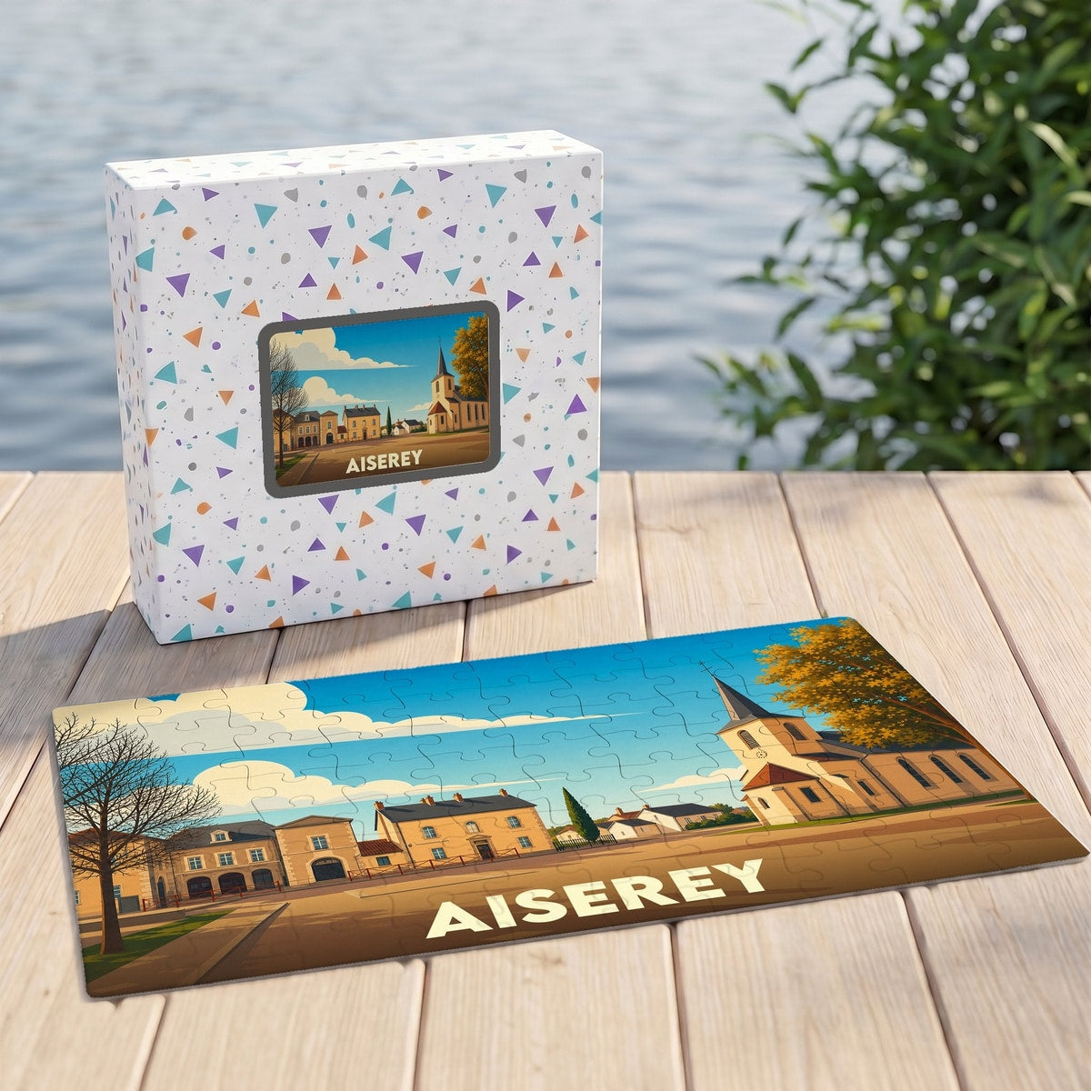 Puzzle souvenir de la ville de Aiserey représentant une illustration stylisée de ses bâtiments et de son église.