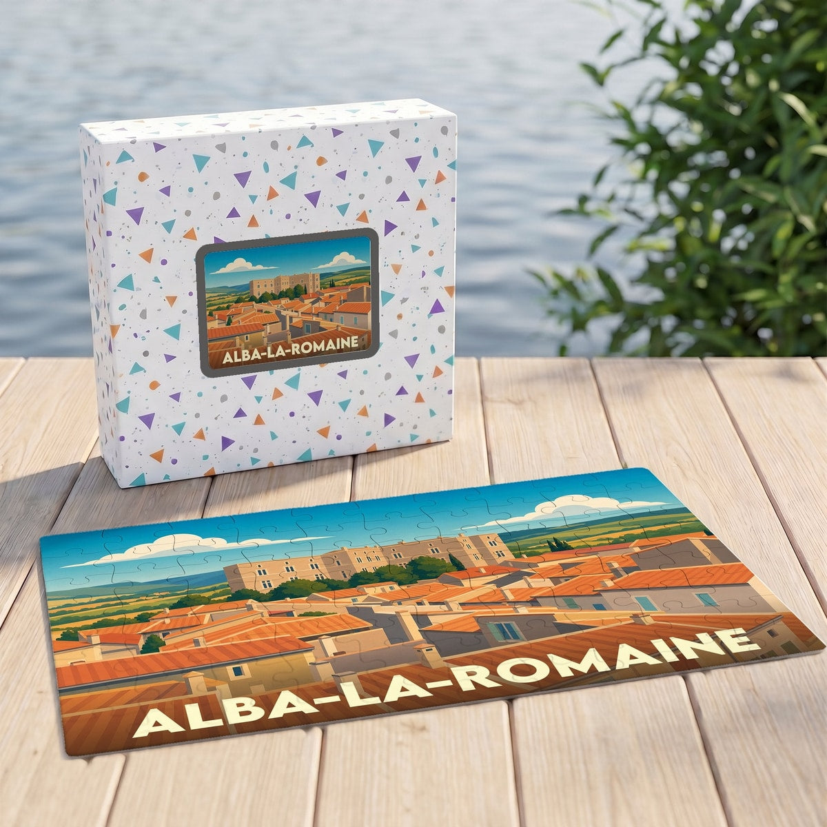 Puzzle souvenir de la ville de Alba-la-Romaine avec une illustration stylisée de ses toits et de son château.