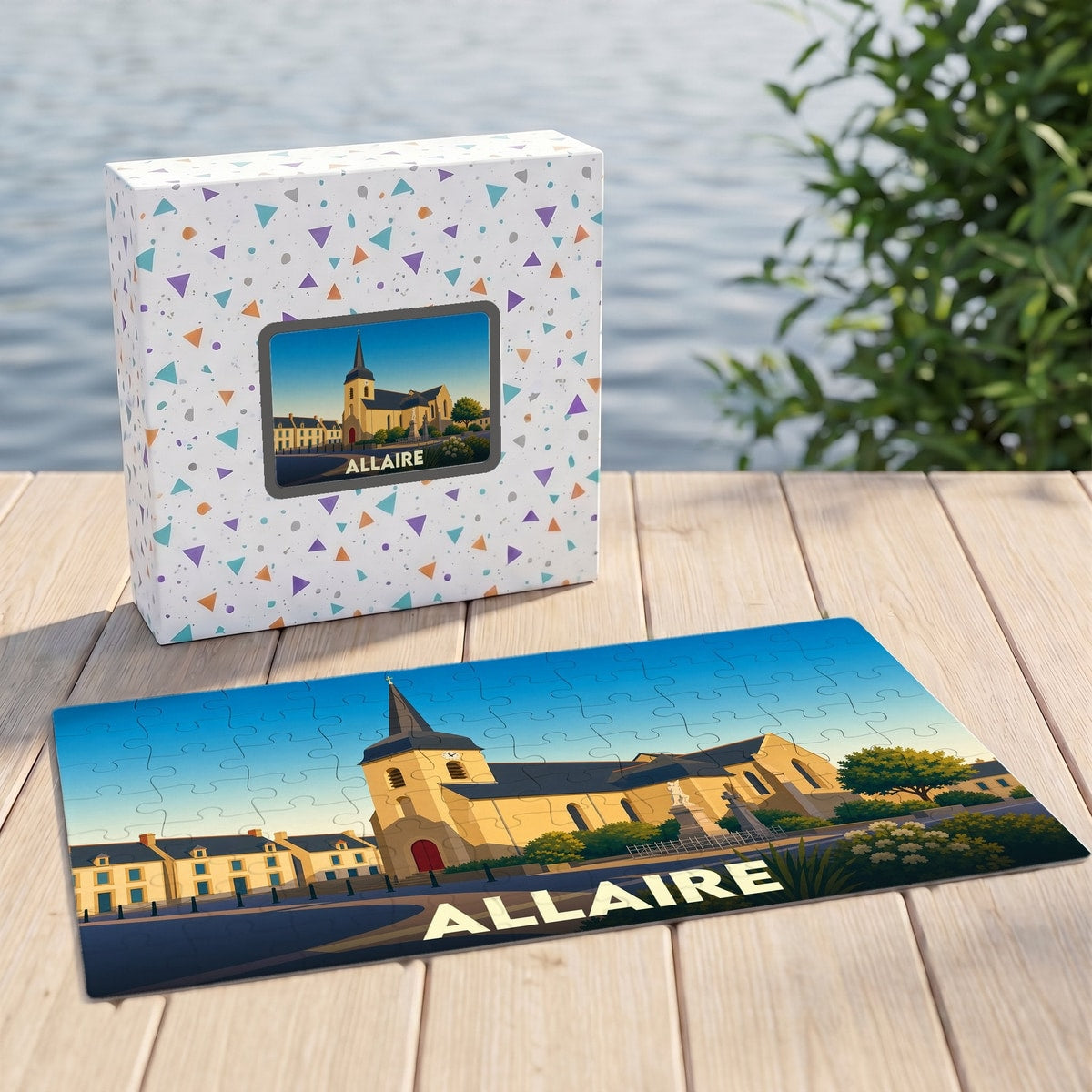 Puzzle souvenir de la ville d'Allaire présentant une illustration stylisée de son église et de ses maisons.