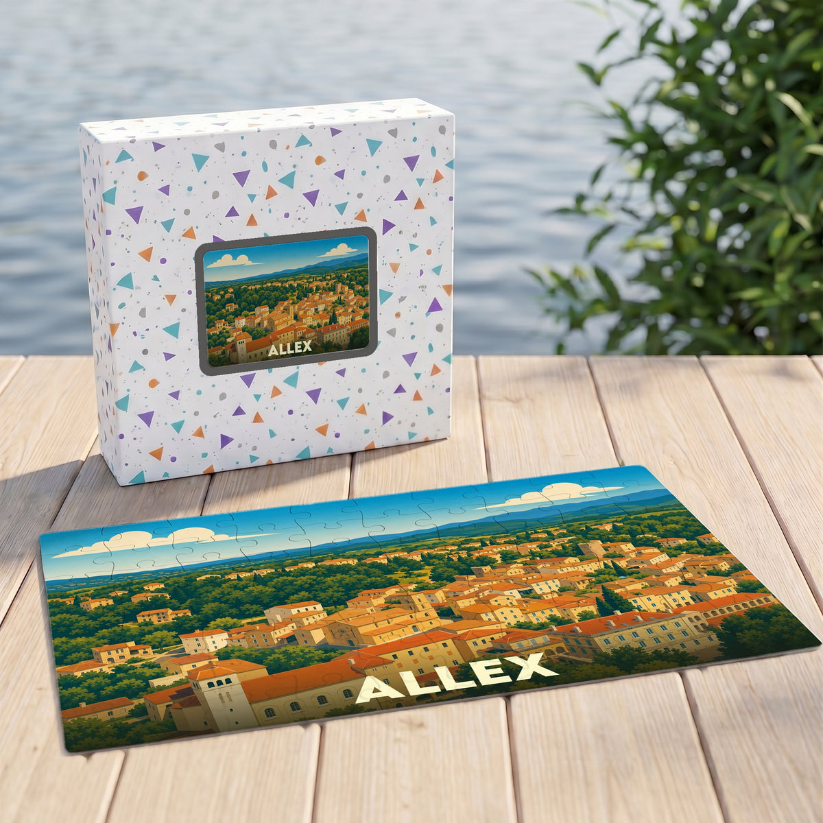 Puzzle souvenir de la ville d'Allex illustré d'un paysage urbain stylisé, présenté avec sa boîte assortie.