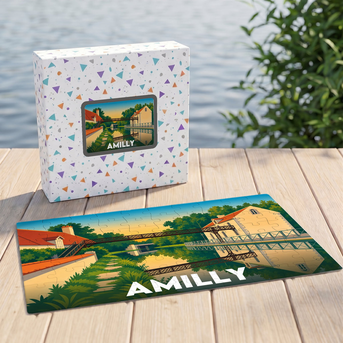 Puzzle souvenir de la ville d'Amilly présentant une illustration stylisée d'un paysage fluvial.