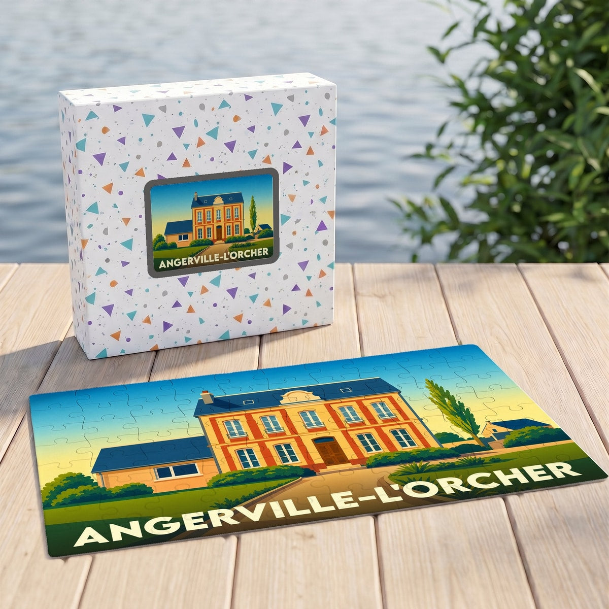 Puzzle souvenir de la ville d'Angerville-l'Orcher avec une illustration stylisée d'une demeure traditionnelle.